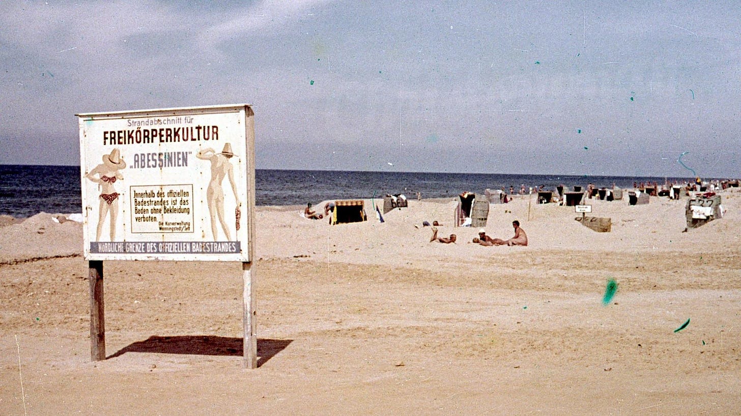 Sylt, late 1960s – Entry to the nudist beach. Public decency enforced the German way: with a very serious sign Sylt, late 1960s – Entry to the nudist beach. Public decency enforced the German way: with a very serious sign