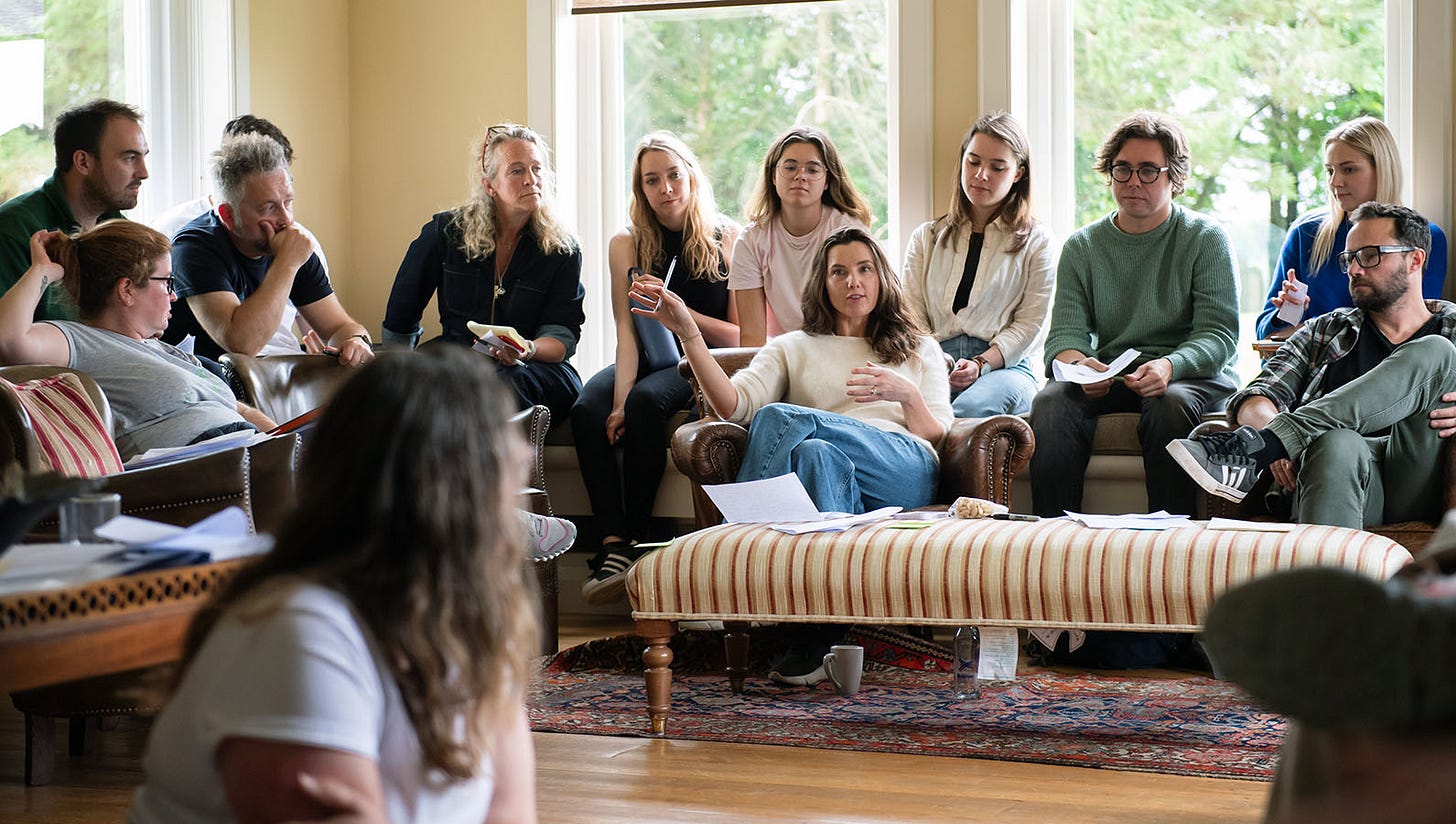 A big group of Nile staff listening to founder Sarah Ronald