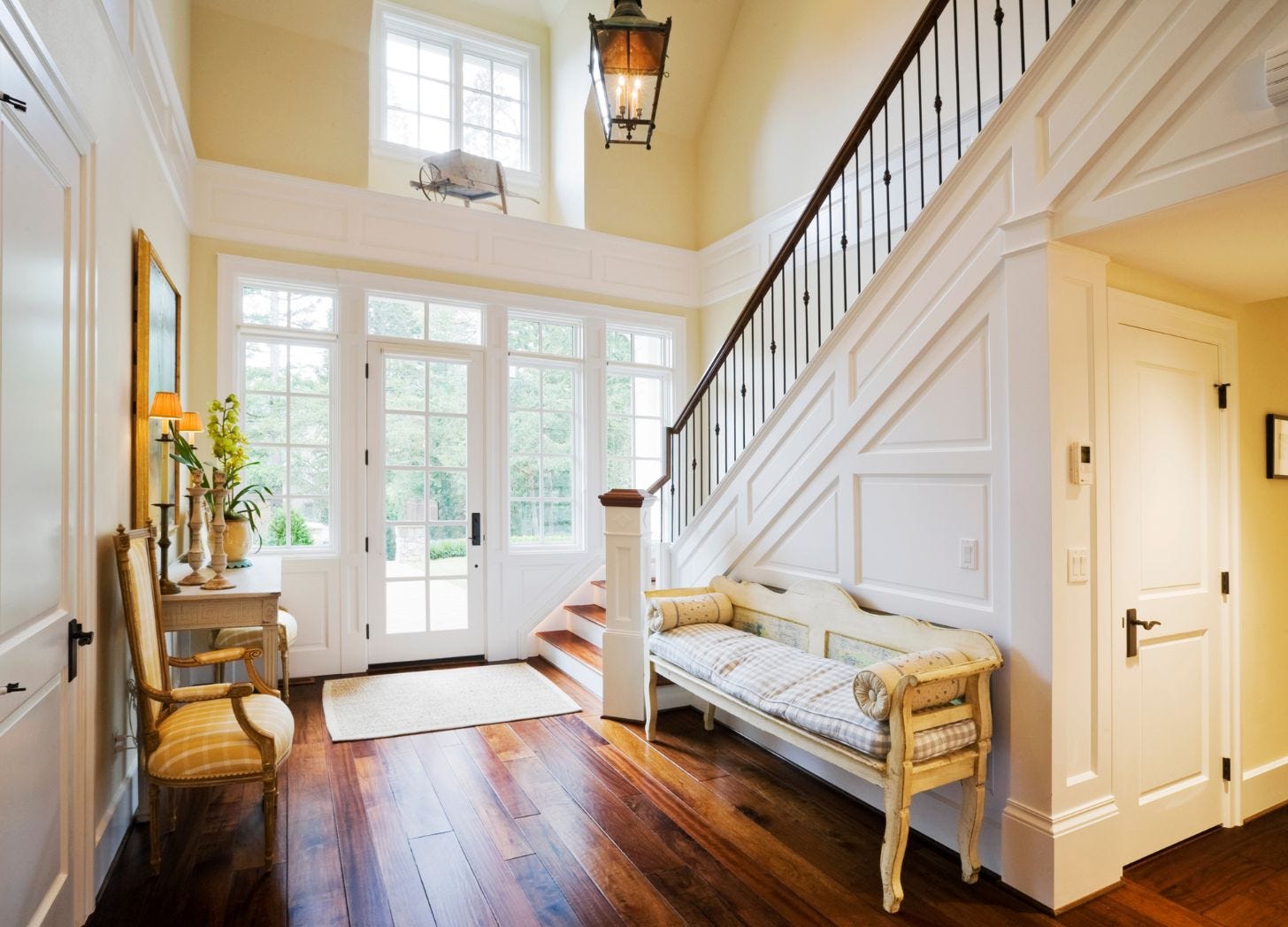 A warm, inviting entryway with soft natural light, a staircase, and a bench—an open, welcoming space symbolizing the start of a smooth, guided stay. A warm, inviting entryway with soft natural light, a staircase, and a bench—an open, welcoming space symbolizing the start of a smooth, guided stay.