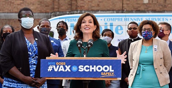 Governor Hochul stands at #VaxToSchool podium