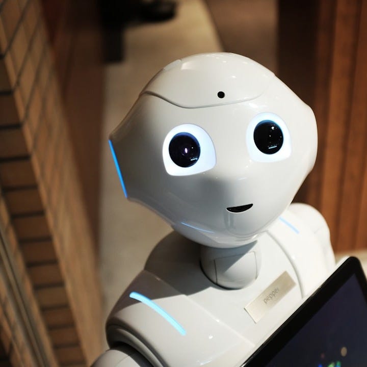 white robot near brown wall white robot near brown wall
