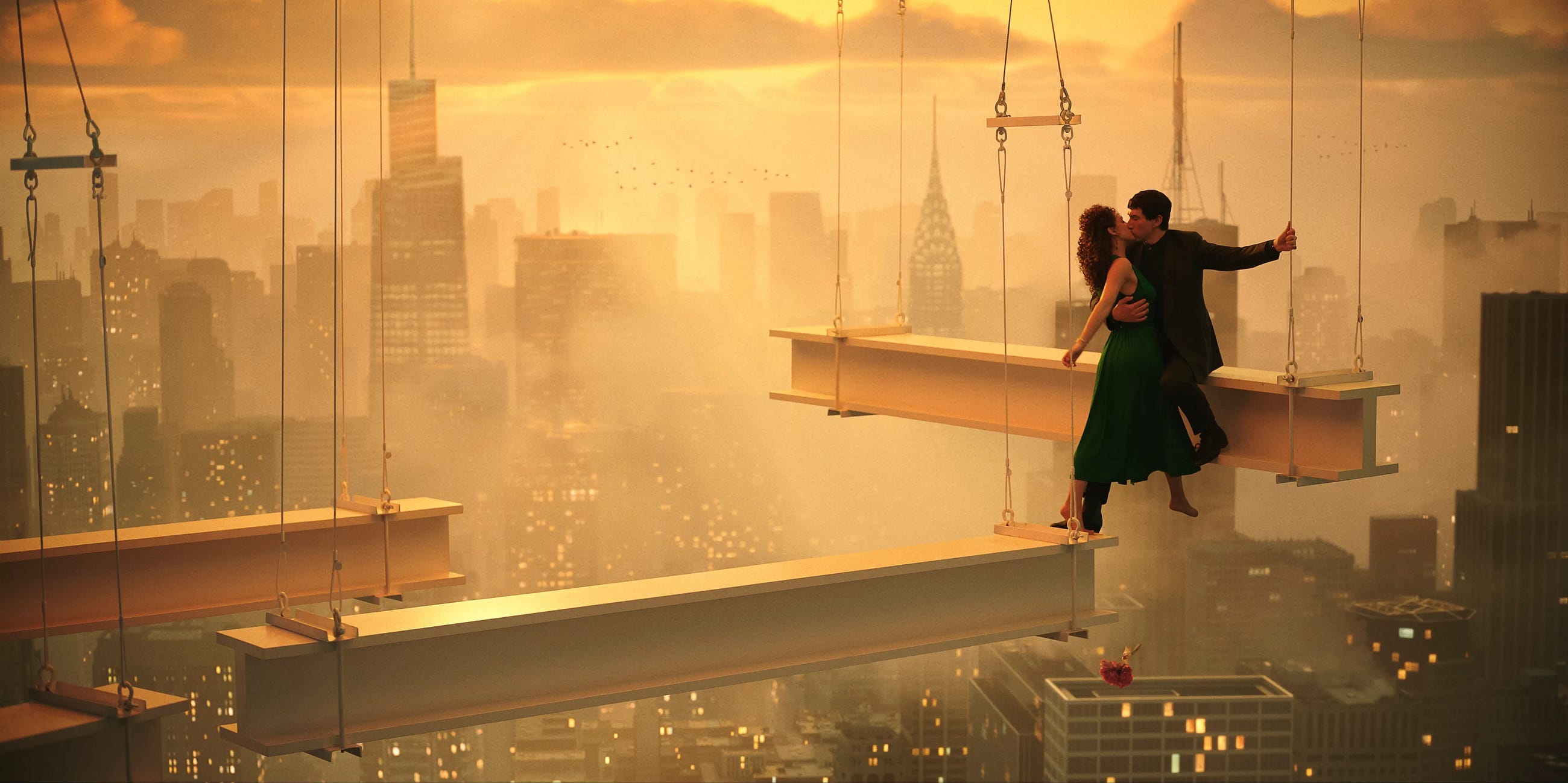Adam Driver as Cesar and Nathalie Emmanuel as Julia kiss atop a construction girder, in Francis Ford Coppola’s ‘Megalopolis.’ PHOTO: Courtesy of Lionsgate