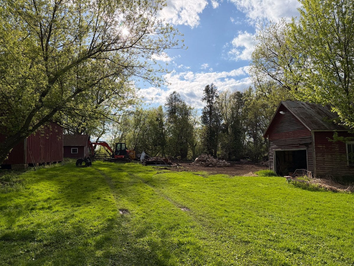 excavation of a fallen barn to create space for a garden on a rural property in Wisconsin