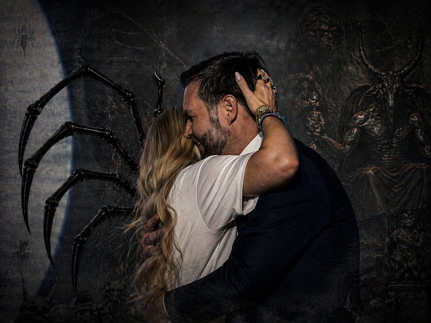 Erika Kirk and JD Vance in the closest form of Black Widow succession: the hand at the back of his hair, the warmth of the embrace, and the body drawn fully near. This is not casual comfort. It is intimacy recoded as transfer — Charlie Kirk’s dead authority emptied, inverted, and moved forward through Erika Kirk toward the next heir.