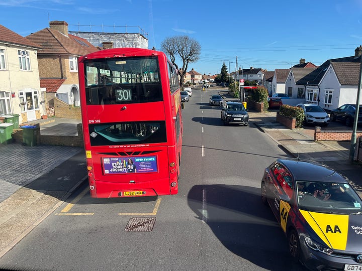 Photo showing narrow streets and following another non-express bus.
