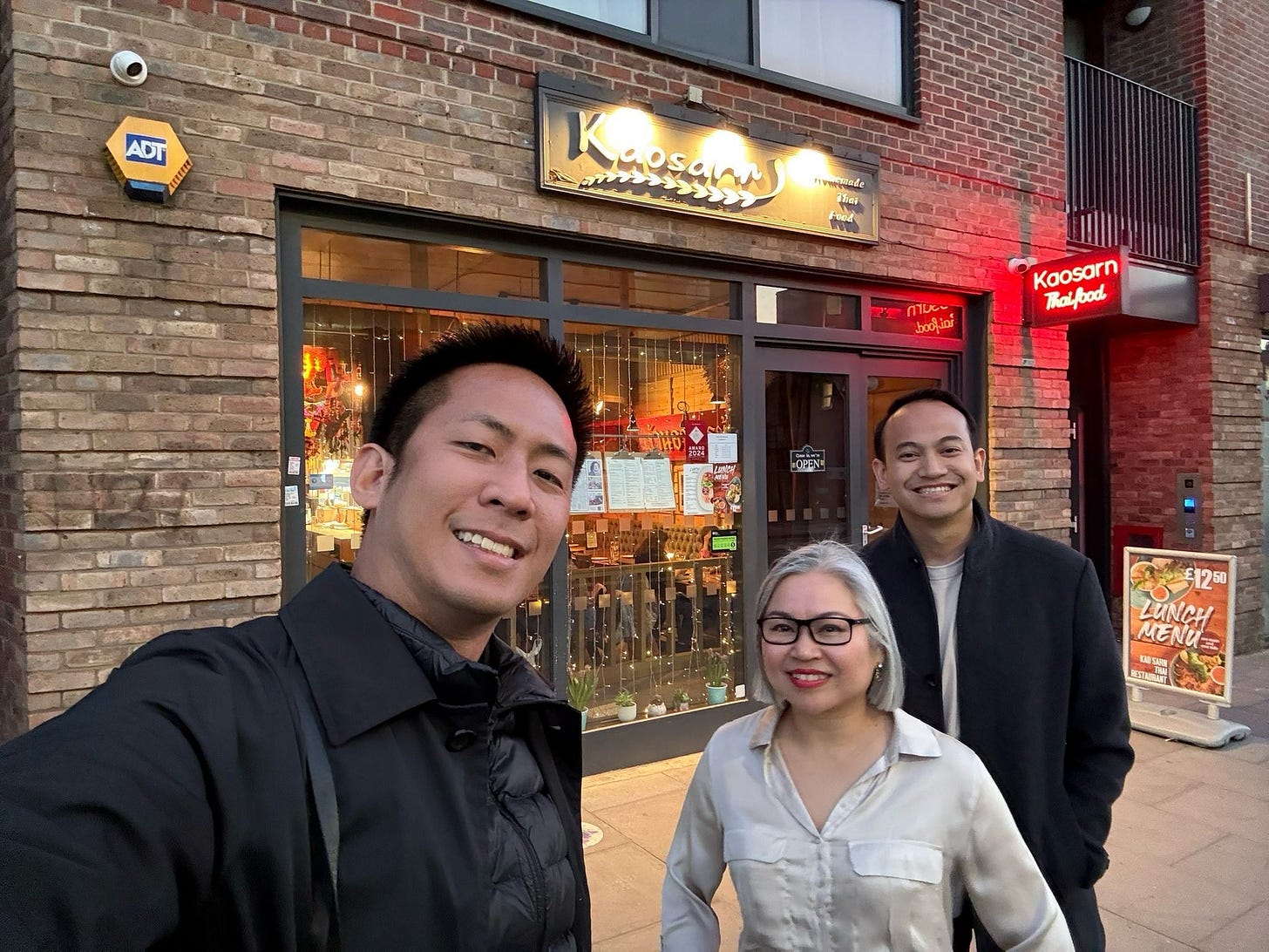 May be an image of 3 people and text