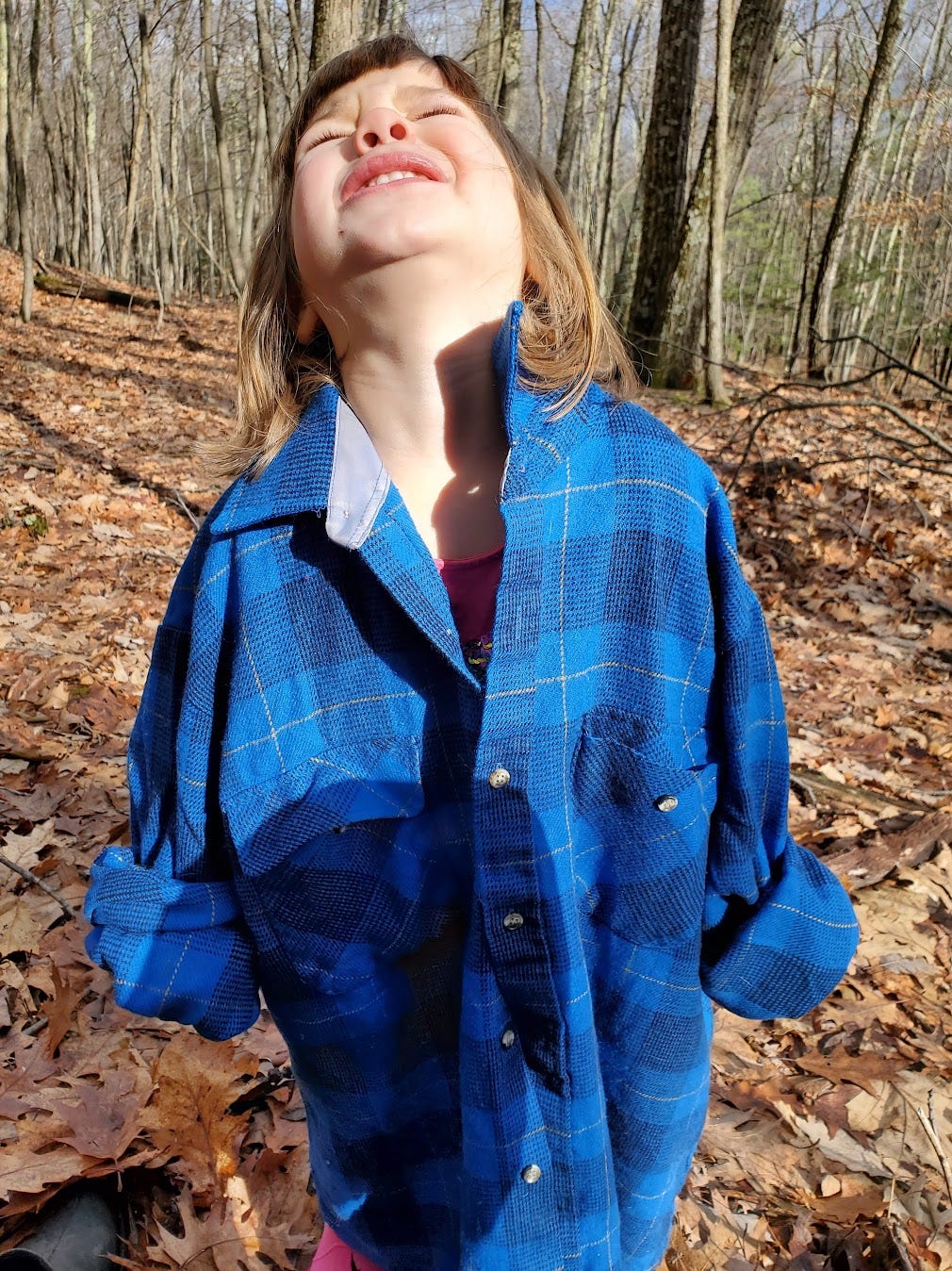 little white girl in plaid shirt is unhappy