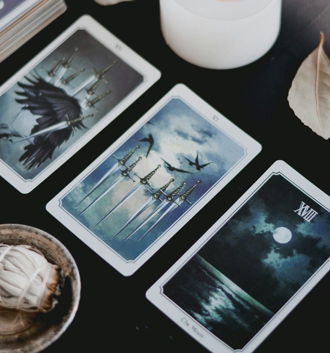 Cards and candle on black background Cards and candle on black background