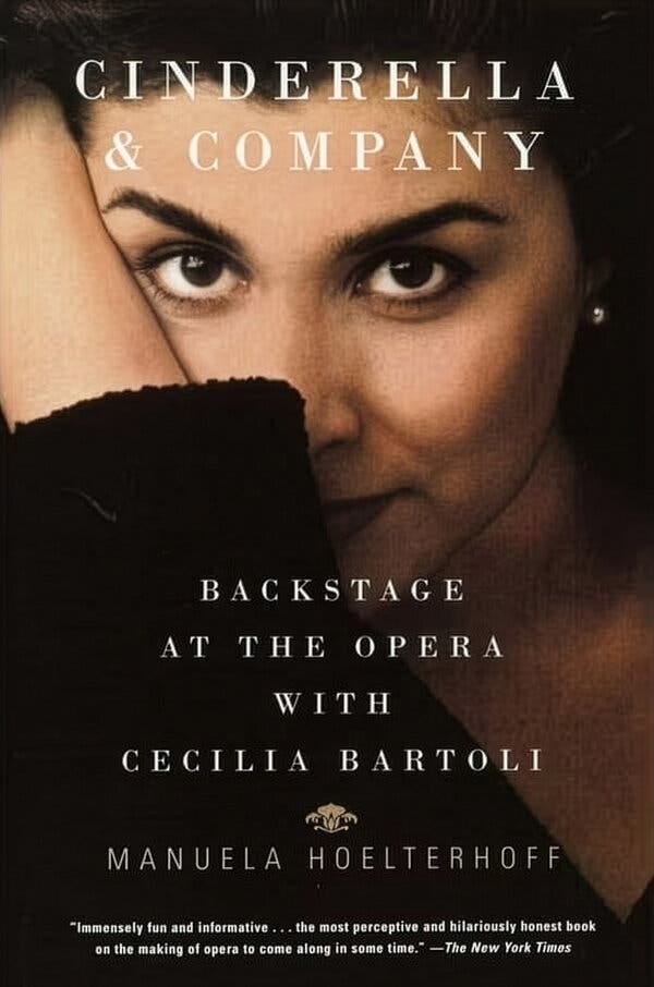A book cover of Manuela Hoelterhoff’s “Cinderella & Company: Backstage at the Opera with Cecilia Bartoli,” showing a woman staring alluringly at the reader.