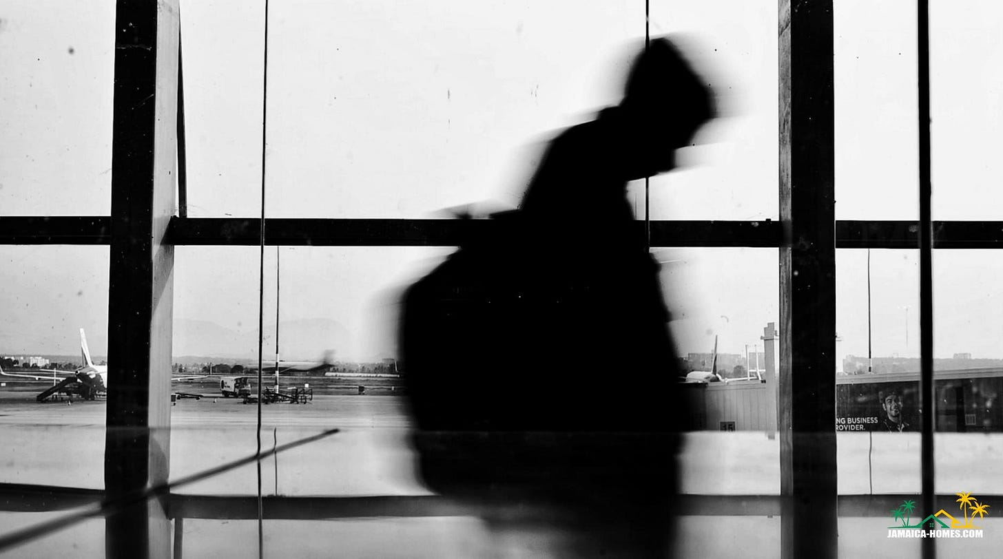 a silhouette of a person walking in an airport