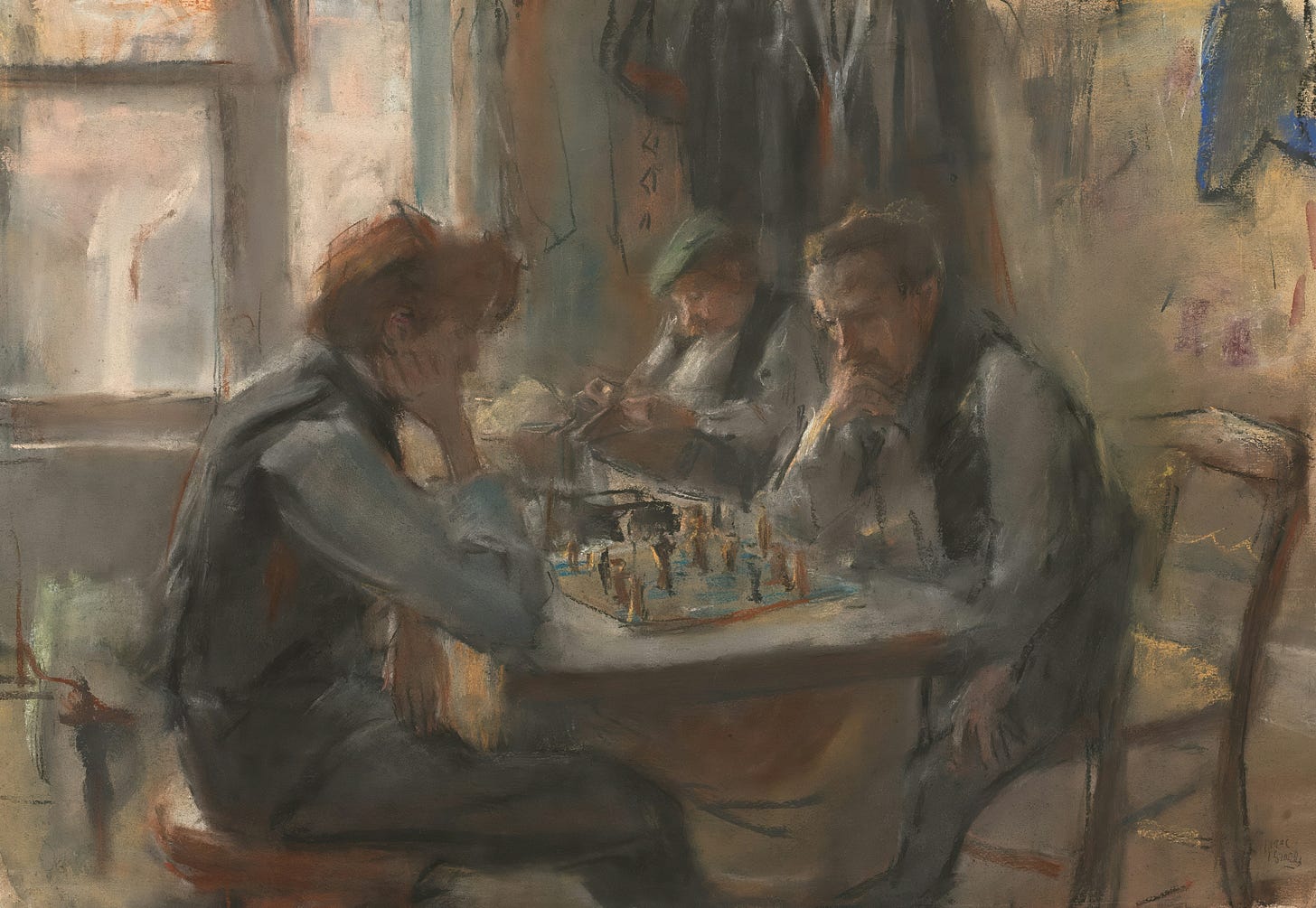 men playing chess and another man next to them reading the newspaper