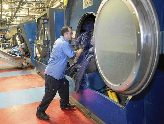 Cintas employee Ricardo Moya loads dirty uniforms into massive washing machines inside the company's Emmaus plant. Headquartered in Cincinnati, Ohio, Cintas Corporation provides highly uniform rental services to businesses of all types throughout the world. The company was named one of the Lehigh Valley's Top Workplaces in the midsize category. Cintas employee Ricardo Moya loads dirty uniforms into massive washing machines inside the company's Emmaus plant. Headquartered in Cincinnati, Ohio, Cintas Corporation provides highly uniform rental services to businesses of all types throughout the world. The company was named one of the Lehigh Valley's Top Workplaces in the midsize category.