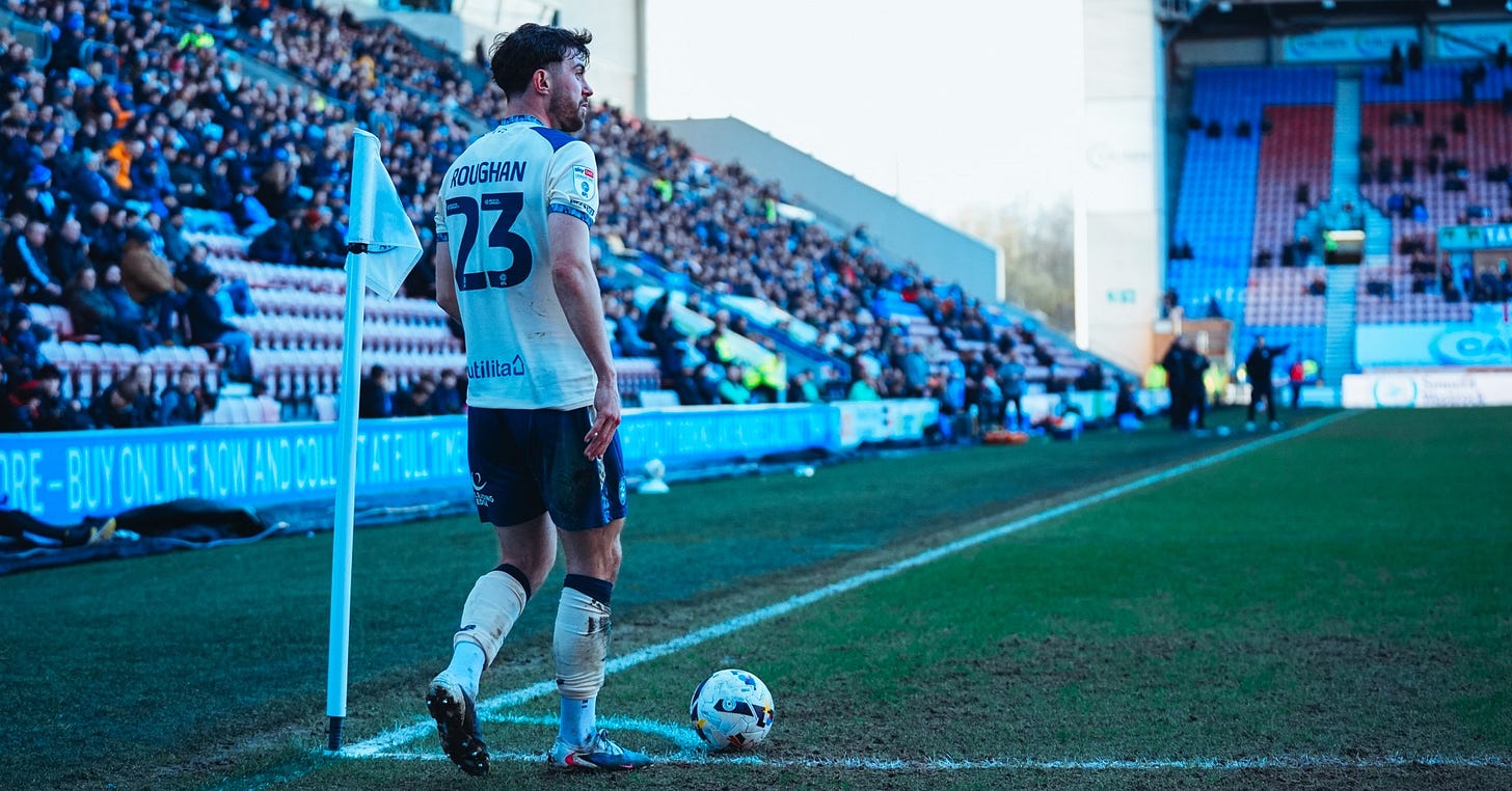 Huddersfield Town player Sean Roughan prepares to take a corner-kick at Wigan. Huddersfield Town player Sean Roughan prepares to take a corner-kick at Wigan.