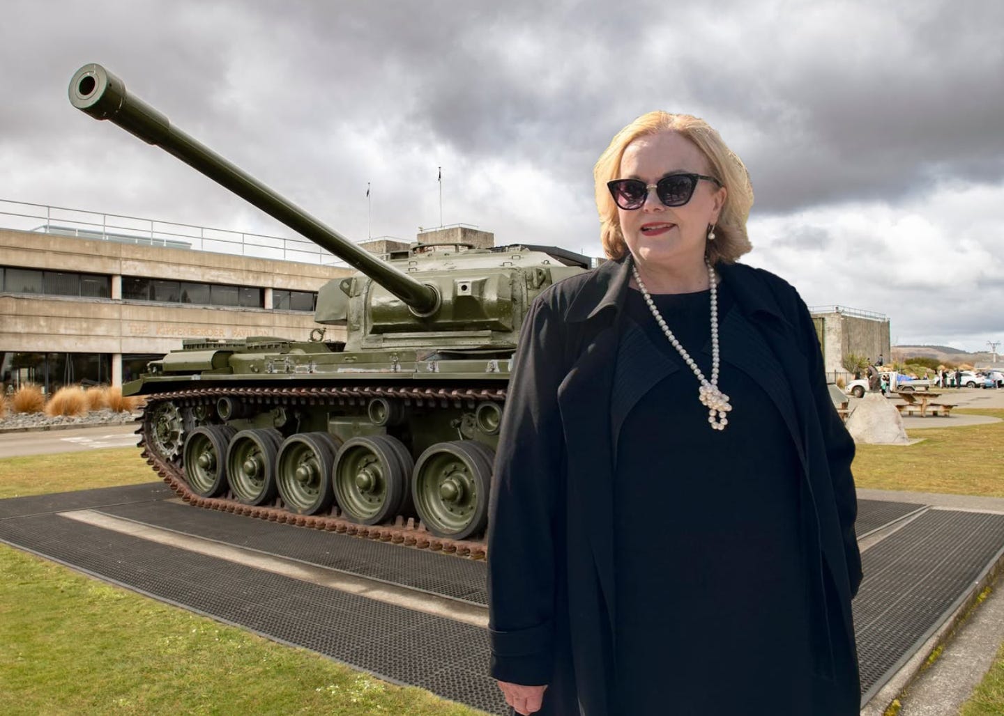 Judith Collins imposed over an image of Waiouru with a tank.