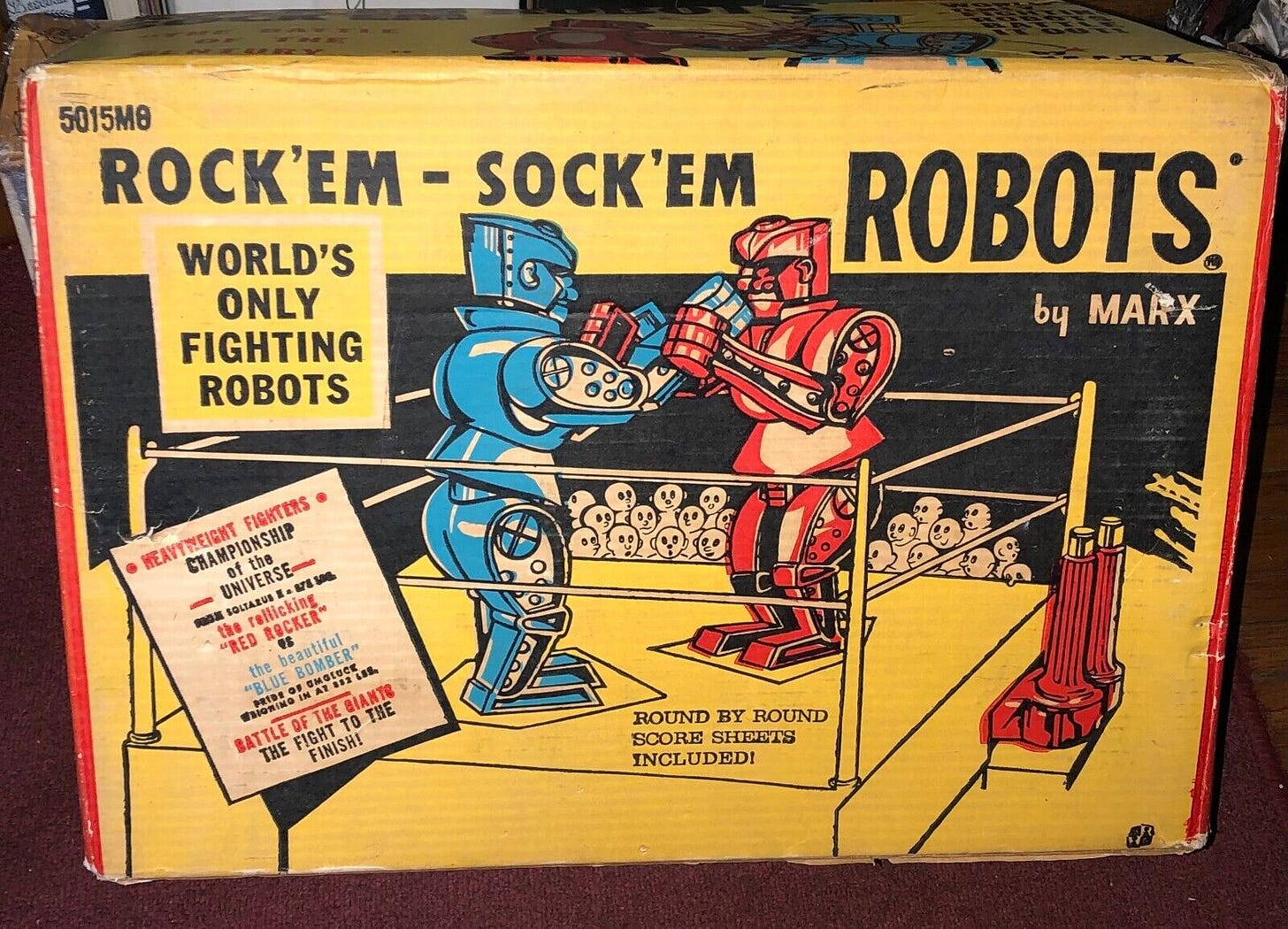 Rock Em Sock Em Robots, a blue toy robot fights a red toy robot Rock Em Sock Em Robots, a blue toy robot fights a red toy robot