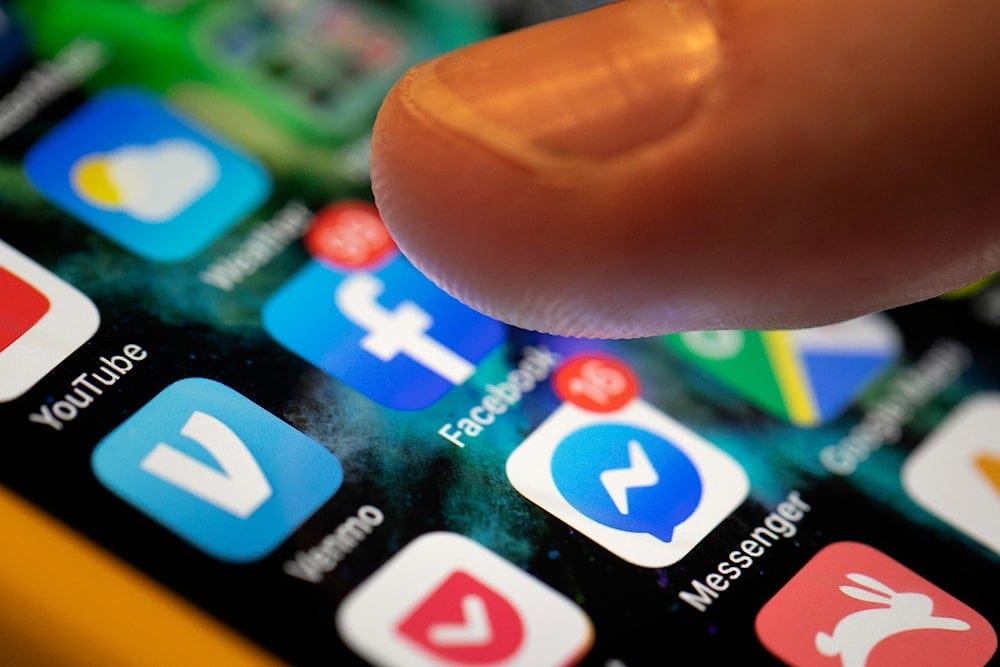 In this Sunday, Aug. 11, 2019, photo an iPhone displays the apps for Facebook and Messenger in New Orleans (AP) In this Sunday, Aug. 11, 2019, photo an iPhone displays the apps for Facebook and Messenger in New Orleans (AP)