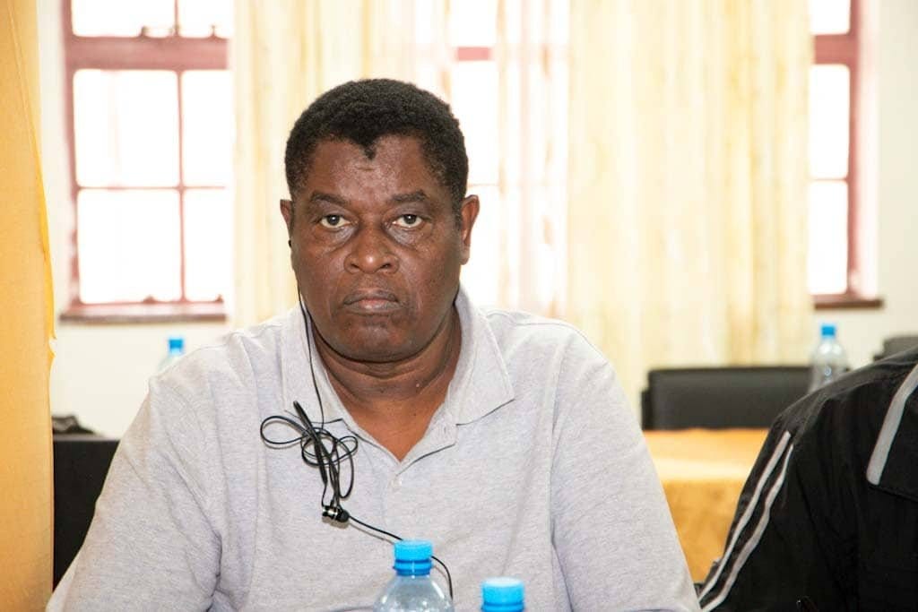 Fr Peter Githui Ndegwa, C.S.Sp., seated at a meeting table Fr Peter Githui Ndegwa, C.S.Sp., seated at a meeting table