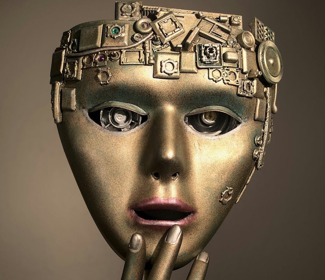a woman's face with a gold mask on her head
