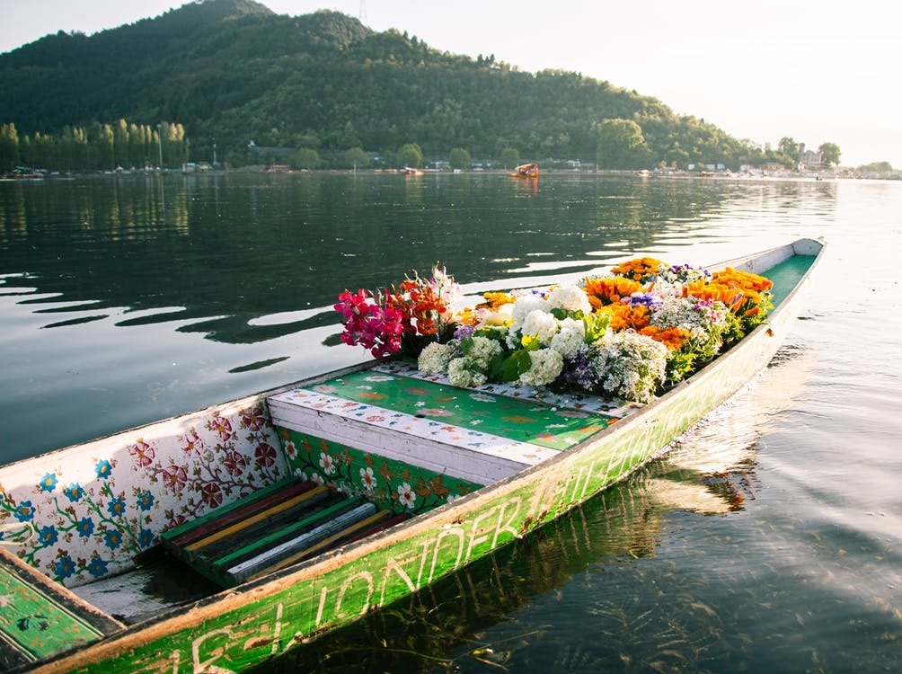 Free Green Wooden Boat on the lake Stock Photo