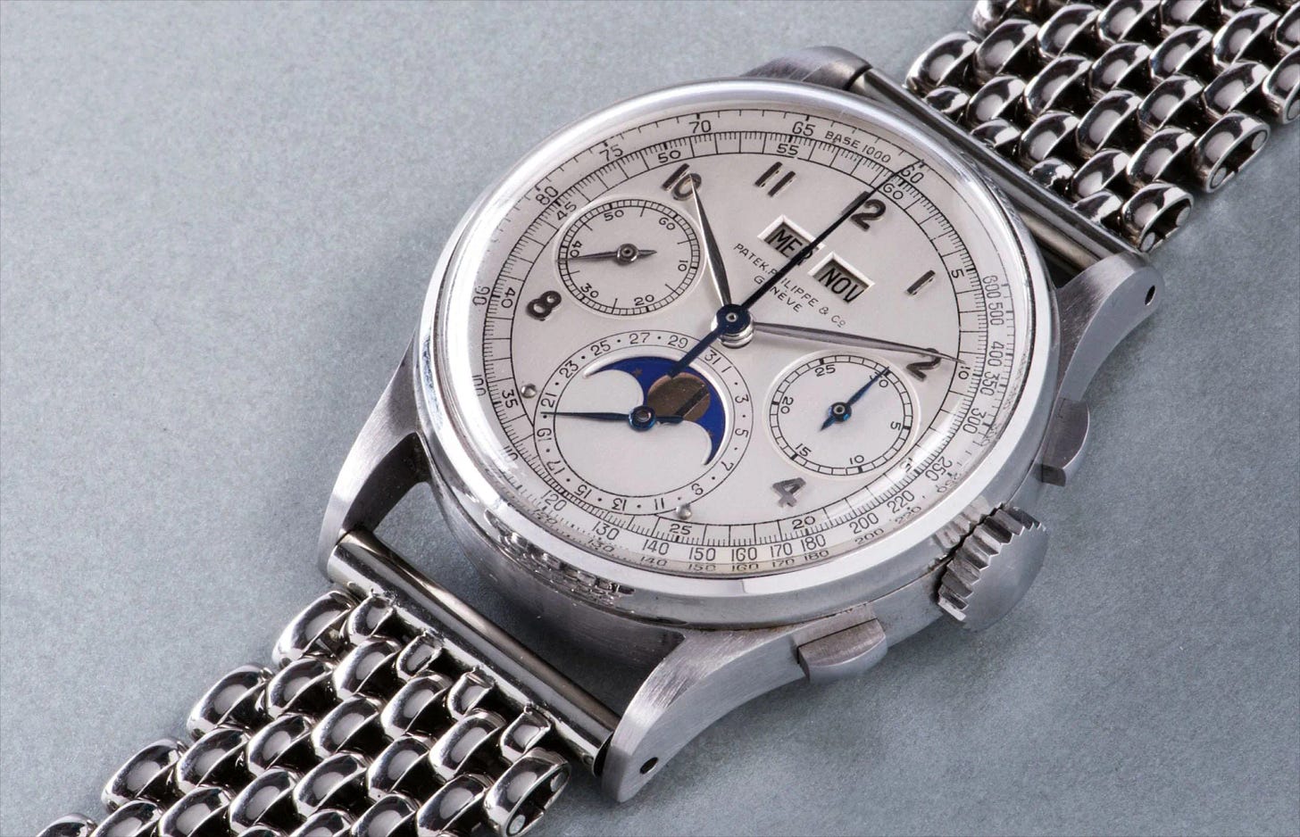 Ref. 1518An extremely rare, highly attractive and historically important stainless steel perpetual calendar chronograph wristwatch with moon phases, applied arabic hour markers, tachymeter scale and bracelet