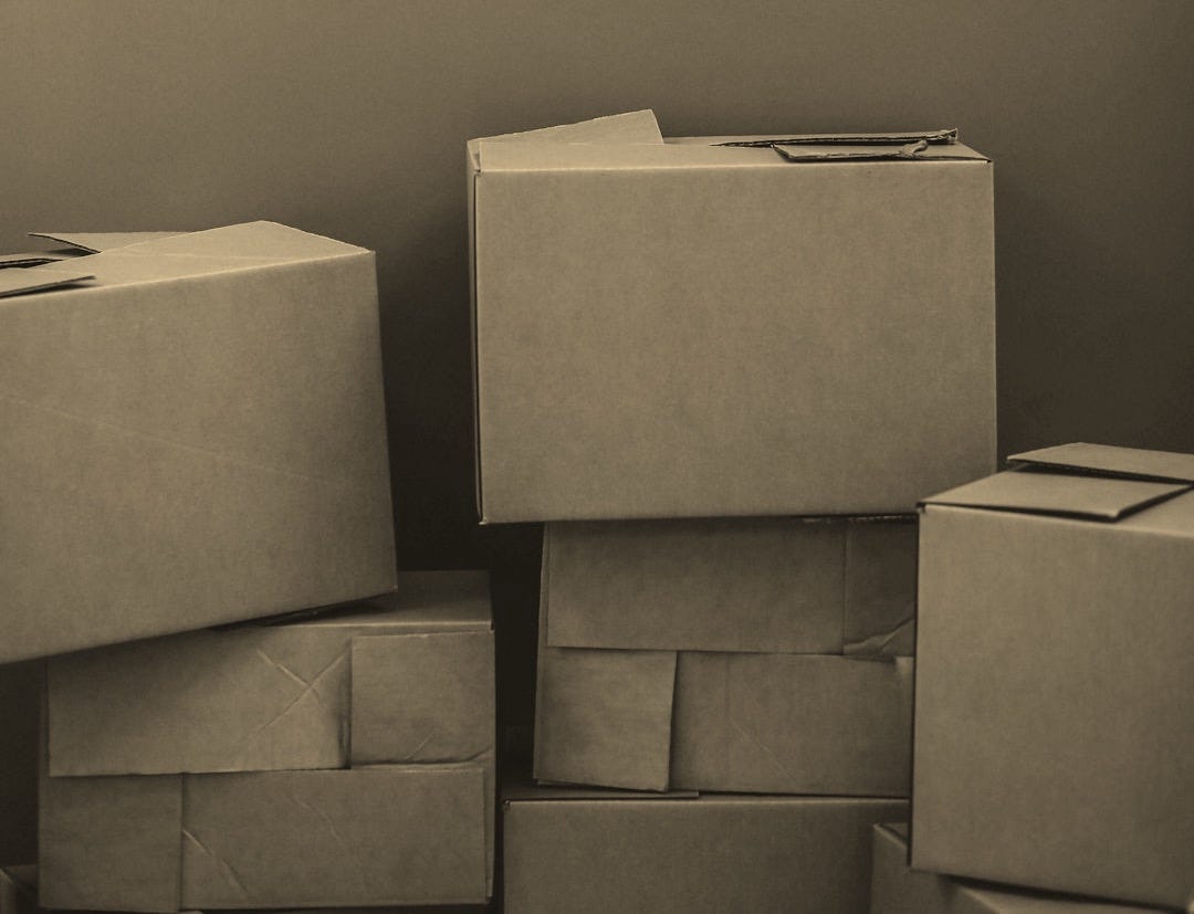 white cardboard box on brown wooden table