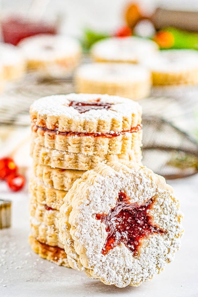 A raspberry Linzer Cookies with star cut outs. A raspberry Linzer Cookies with star cut outs.