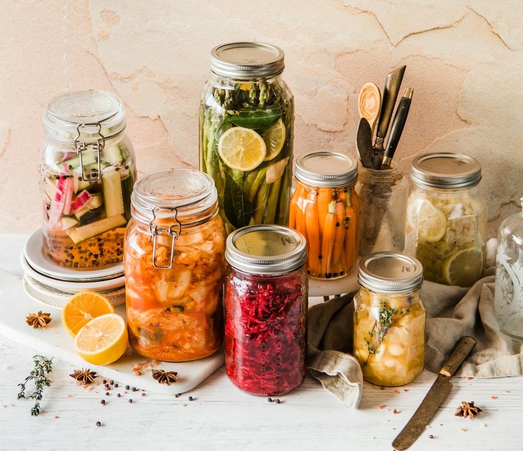 shallow focus photo of assorted jar lot shallow focus photo of assorted jar lot