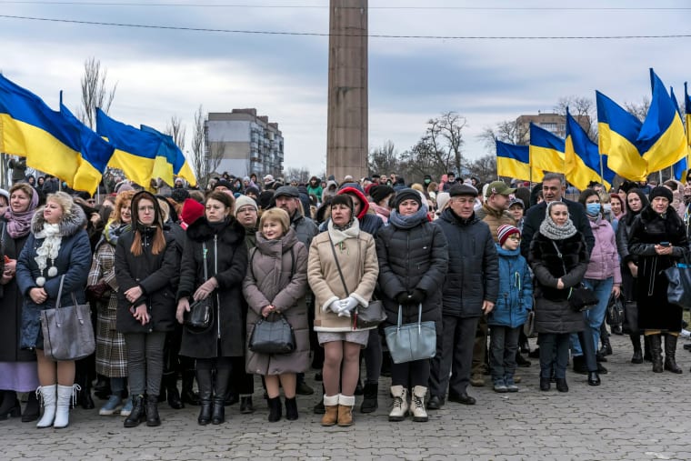 People gather for a ceremony to mark Unity Day in Kherson, Ukraine, on Wednesday, Feb. 16, 2022. (Brendan Hoffman/The New York Times)
