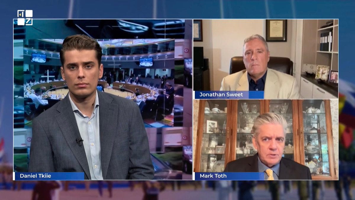 A group of men on a television screen
AI-generated content may be incorrect. A group of men on a television screen
AI-generated content may be incorrect.