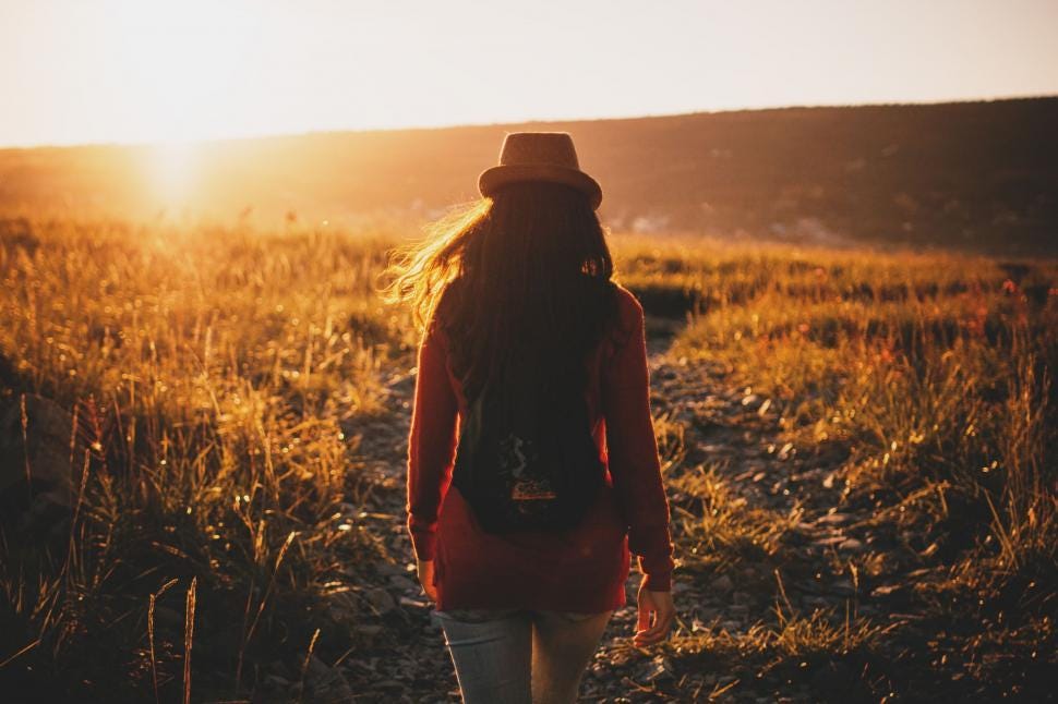 Free Stock Photo of Woman Walking Through Field at Sunset | Download Free  Images and Free Illustrations