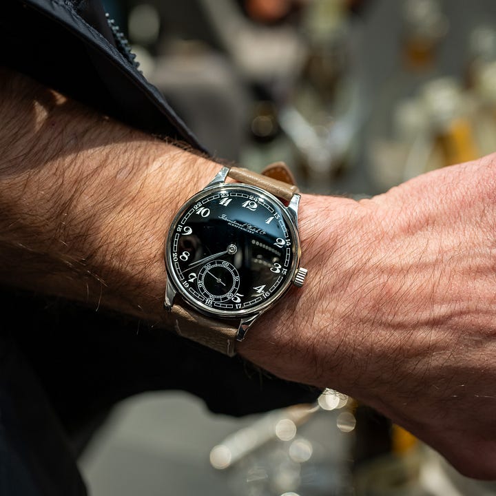 A pair of very different IWCs: An original Portugieser ref. 325 from the 1940s and a gold Mark XII. 