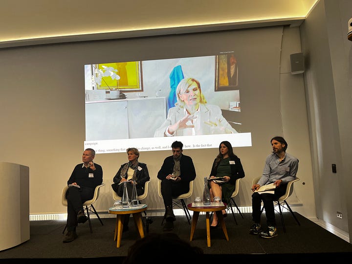 Two photos of panels at the conference