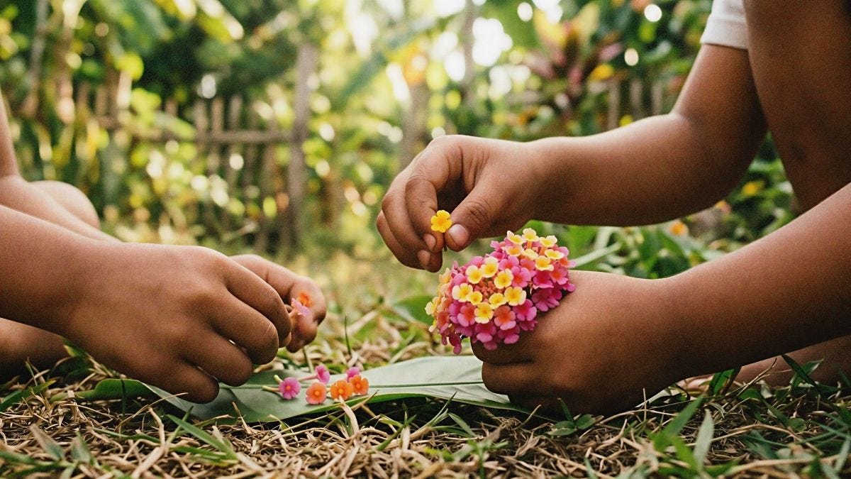 Children's hands picking individual tiny Lantana camara flowers in pink, yellow, and orange, sitting outdoors on grass in a tropical Filipino setting.