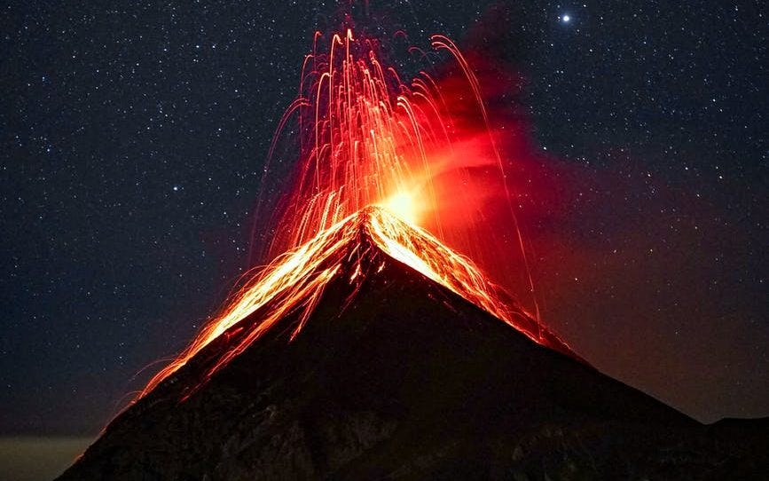 A volcano erupting at night.
Photo by Clive Kim on Pexels.com