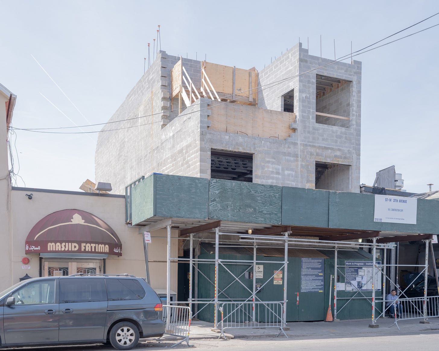 Cinder block construction going up adjacent to Mosque