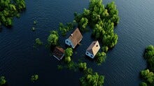 Overhead View Of Flooded Houses Surrounded By Lush Greenery.