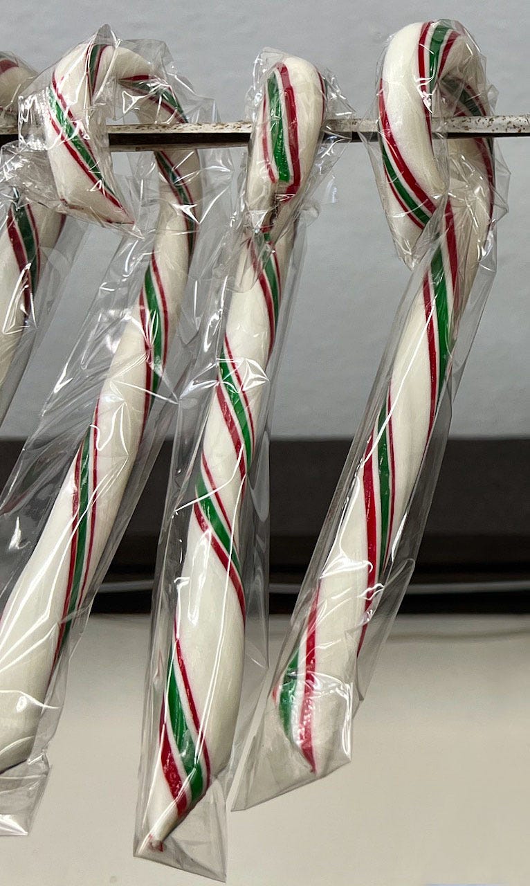 A group of candy canes in plastic wrap

Description automatically generated