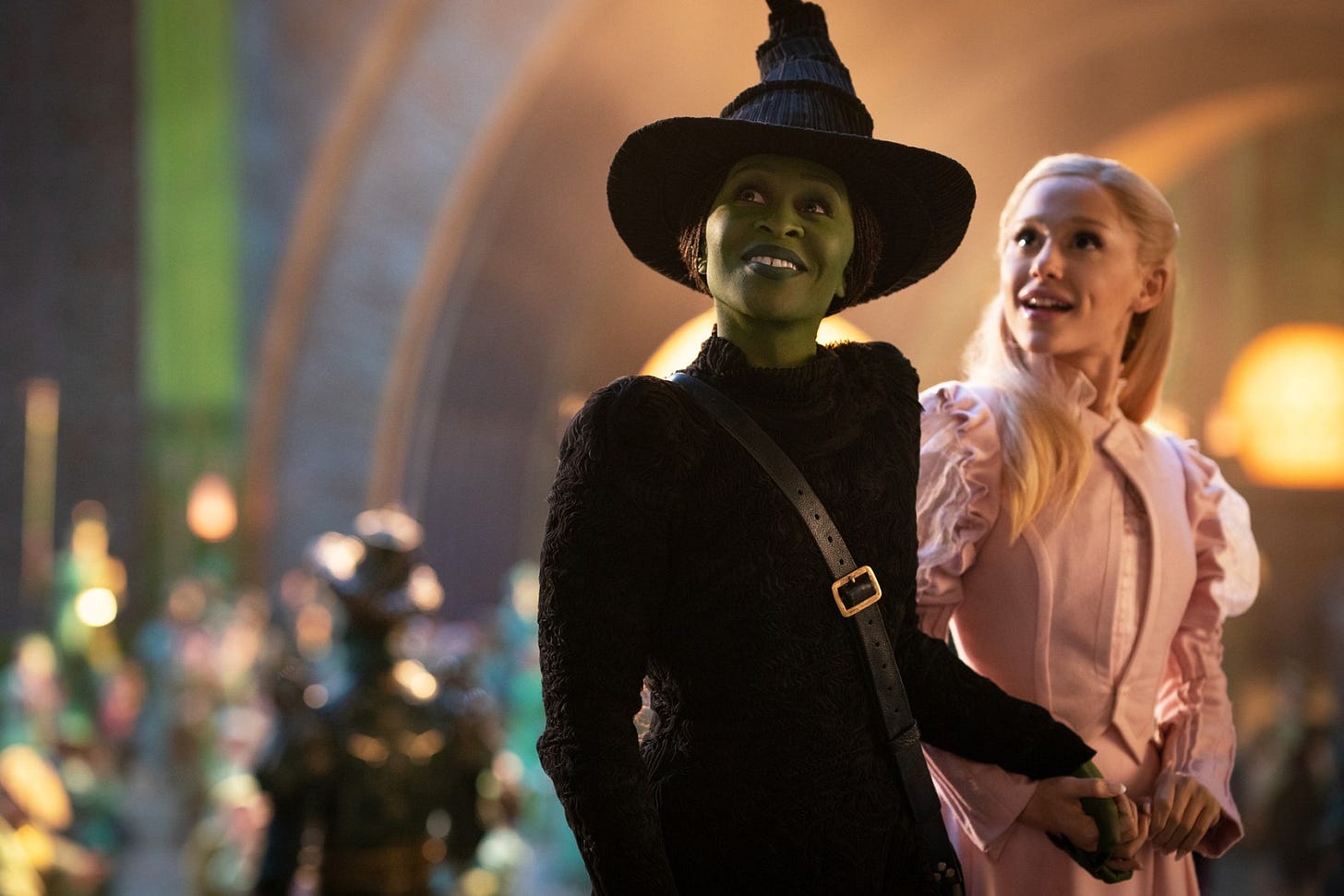 L to R: Cynthia Erivo is Elphaba and Ariana Grande is Glinda in WICKED, directed by Jon M. Chu