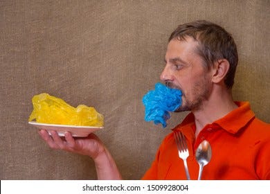 Man Eating Plastic Bag On Plate Stock Photo 1505980751 | Shutterstock