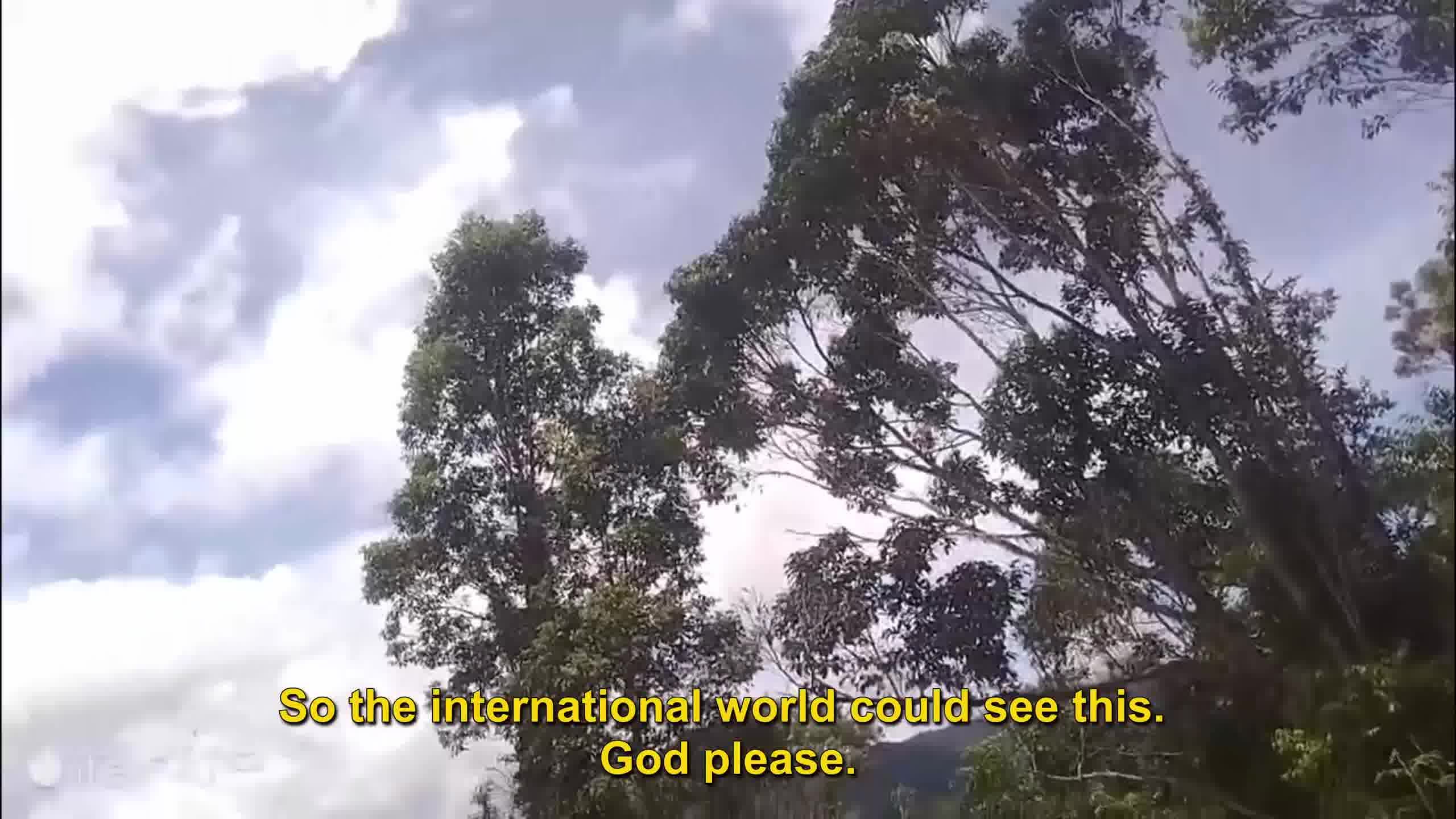 A still from a video of Embraer EMB 314 Super Tucano bombing and strafing the mountains of Kiwirok on October 6, 2025