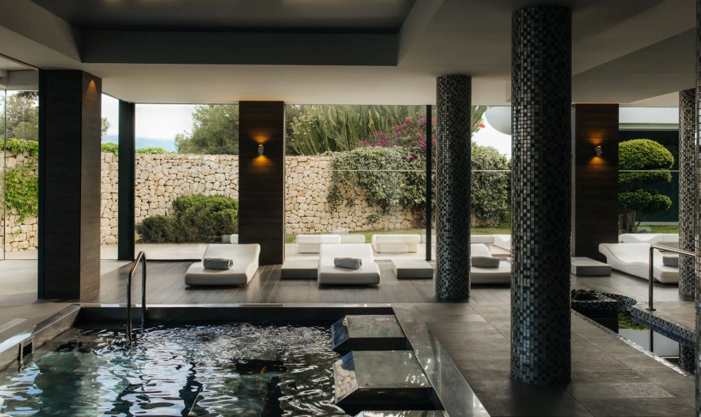 Indoor wellness pool at SHA Wellness featuring contemporary architecture and a tranquil atmosphere.