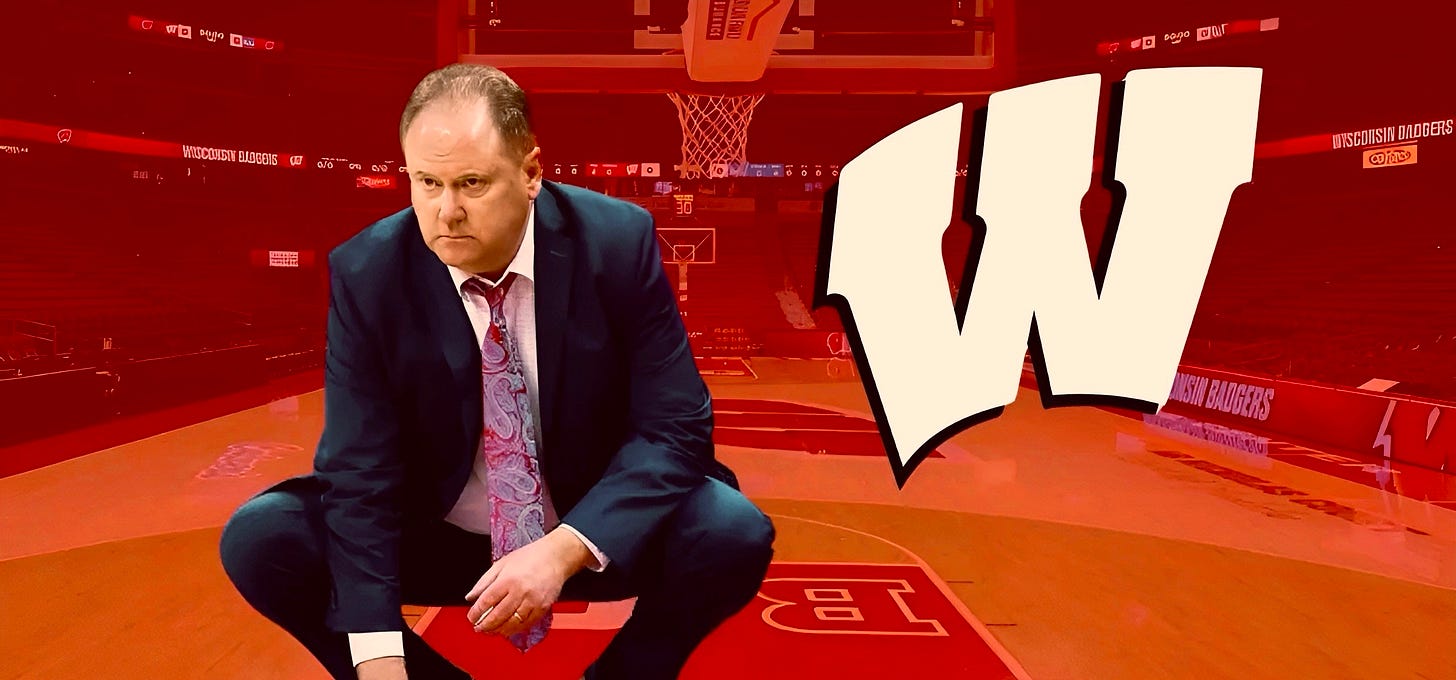 Wisconsin Badgers head basketball coach Greg Gard crouching down