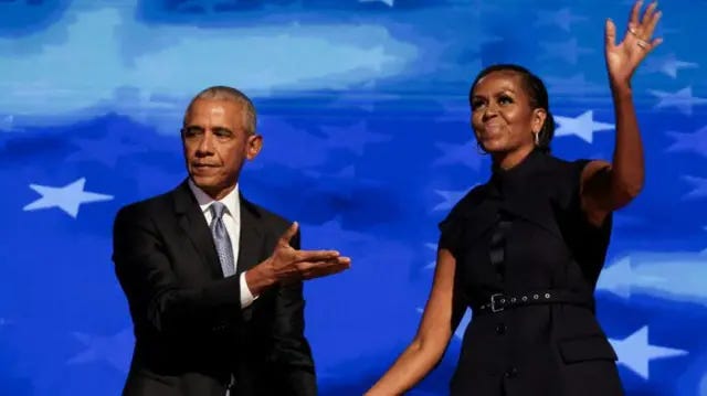 Barack Obama and Michelle Obama wearing black in front of a blue background