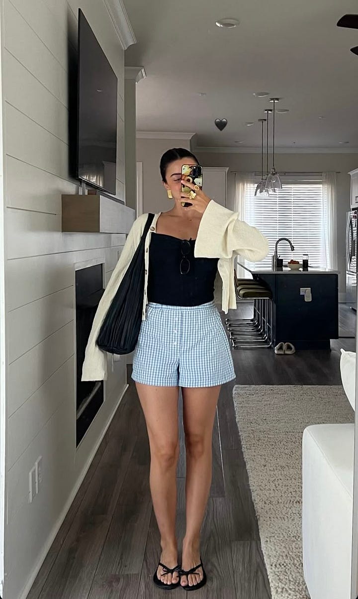 people wearing black top with blue and white shorts