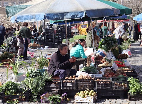 Scenes from a market showing fruit and vegetables and the sellers