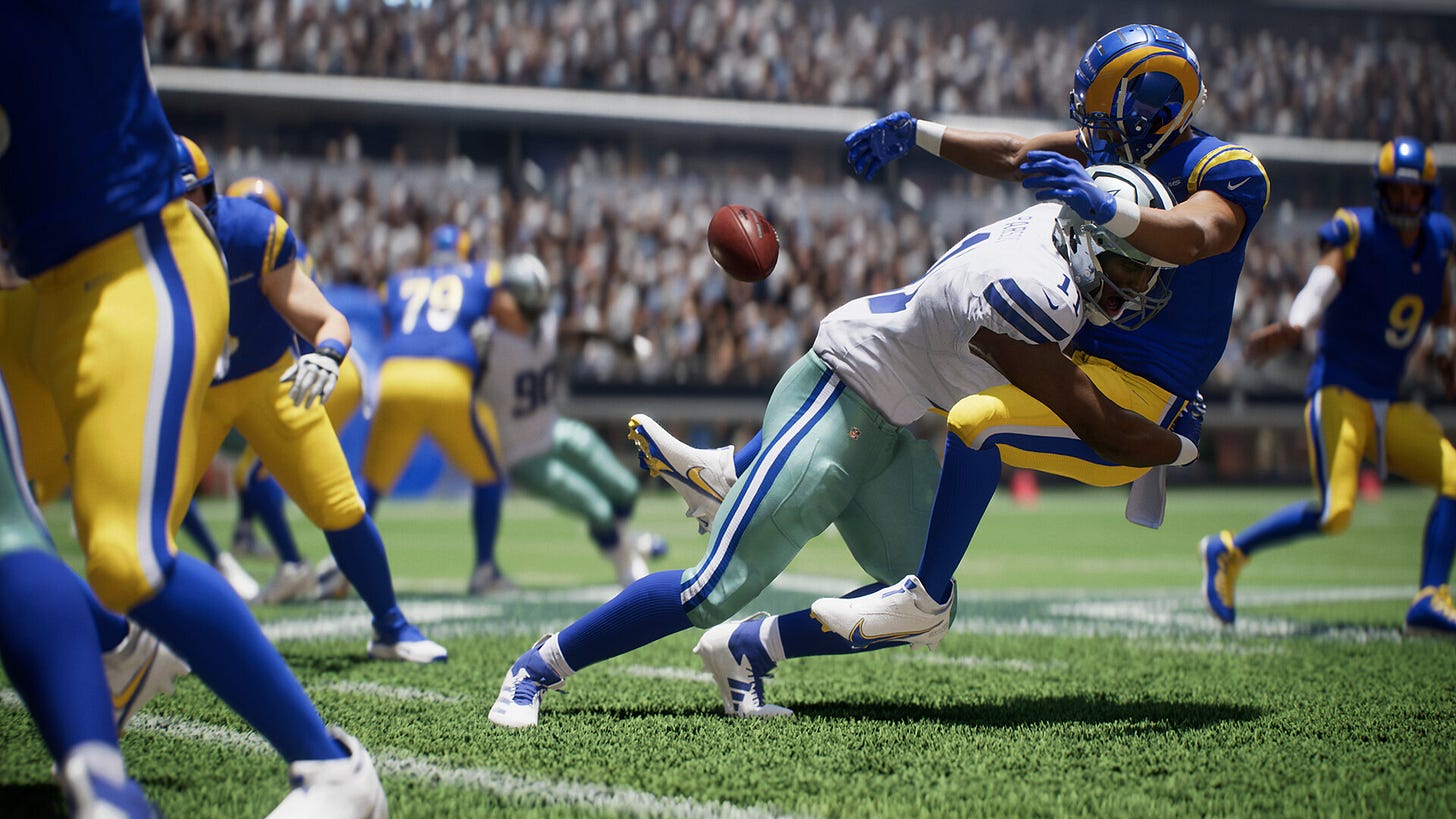 Video game screenshot of a football player tackling another one