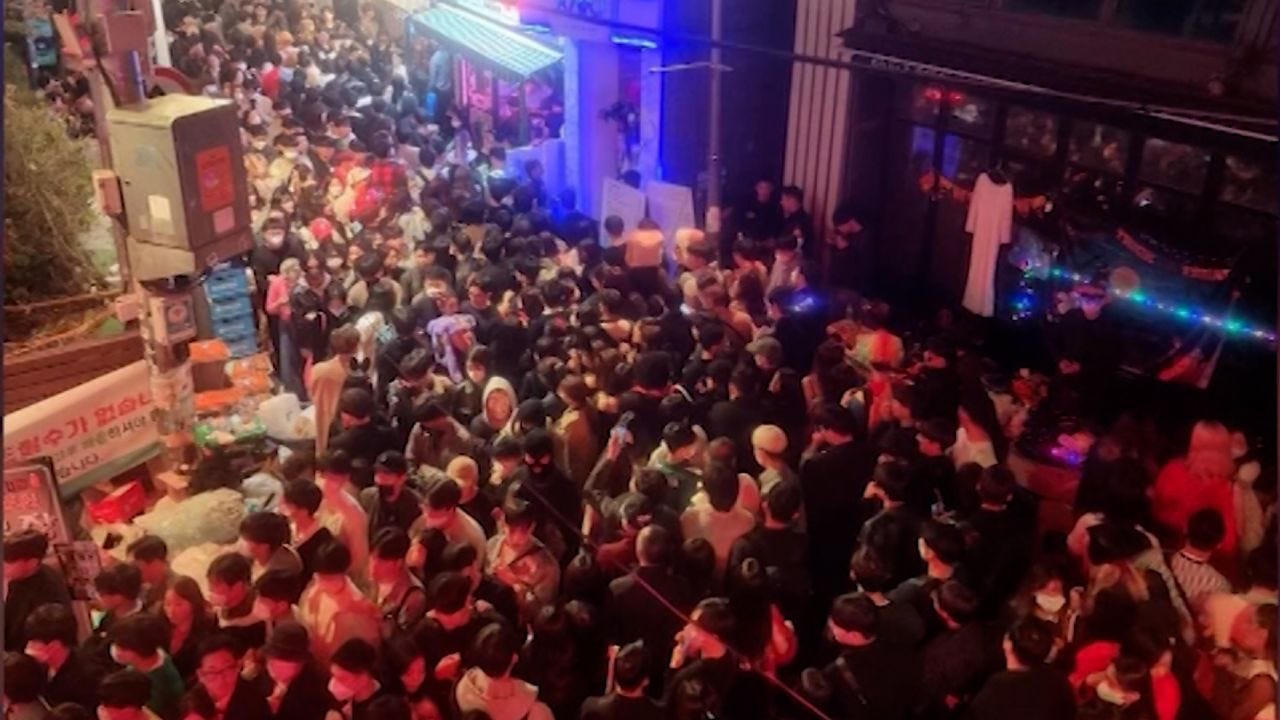 Social media videos show huge crowd crammed into alley