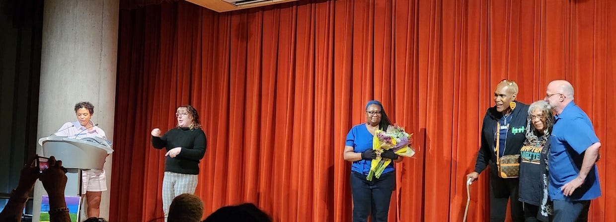 Queer Voices founders honored at reading.