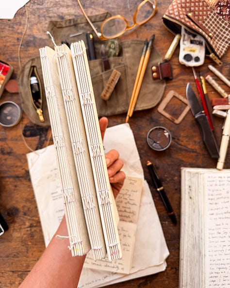 worn handbound notebooks, filling up, loved