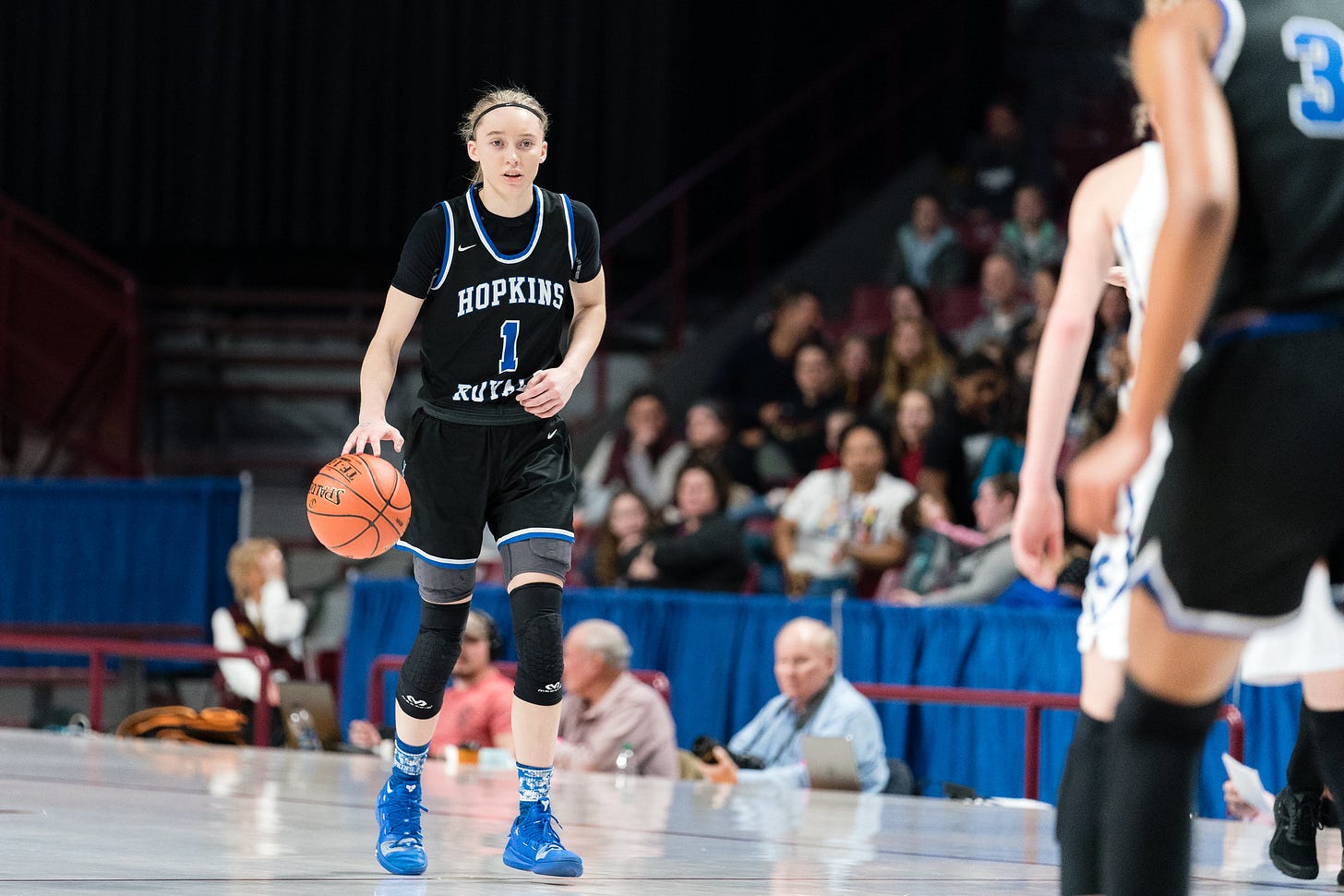 Basketball player Paige Beckers dribbling Basketball player Paige Beckers dribbling